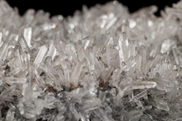 Macro mineral stone sulfite quartz on a black background