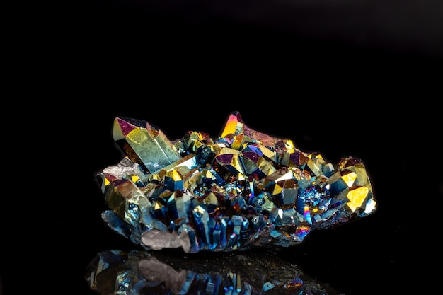 Photo macro mineral stone titanium quartz flame aura quartz on a black background