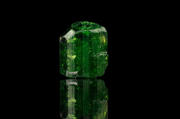 Macro mineral stone tourmaline on a black background