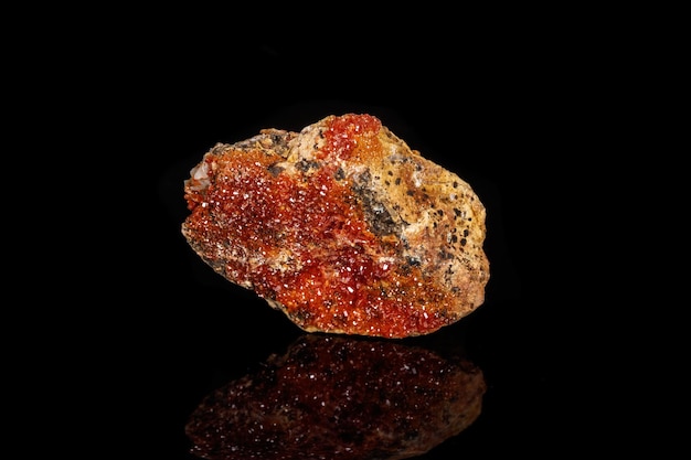 Macro mineral stone Vanadinite on a black background