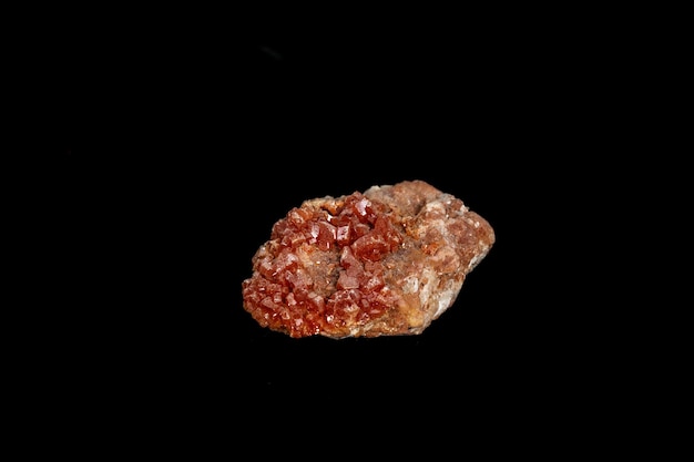 Macro mineral stone Vanadinite on a black background