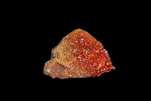 Macro mineral stone Vanadinite on a black background