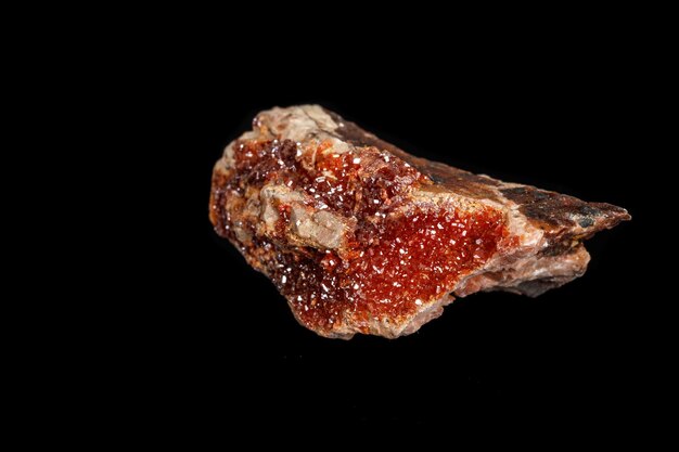 Macro mineral stone Vanadinite on a black background