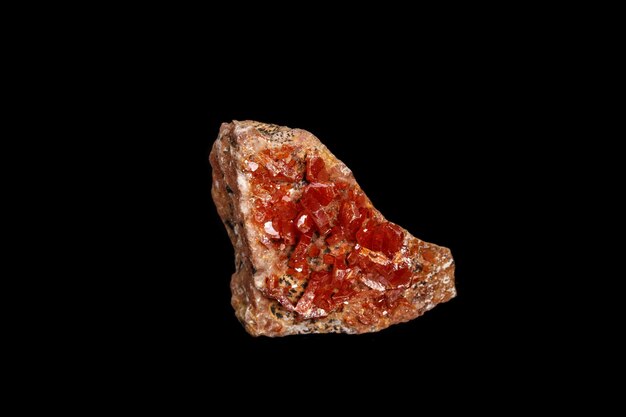 Macro mineral stone Vanadinite on a black background