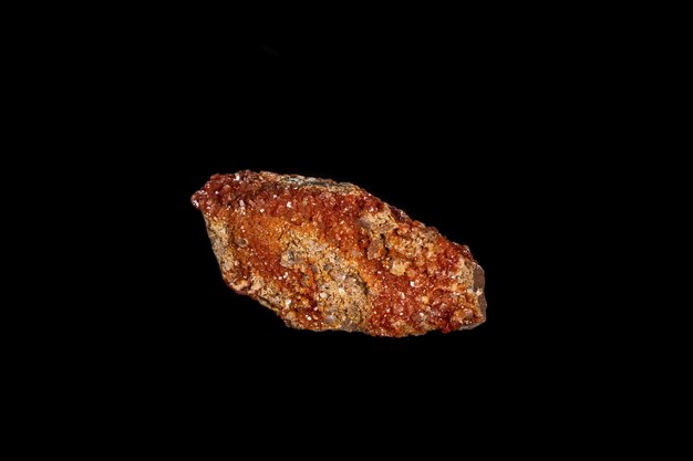 Macro mineral stone Vanadinite on a black background