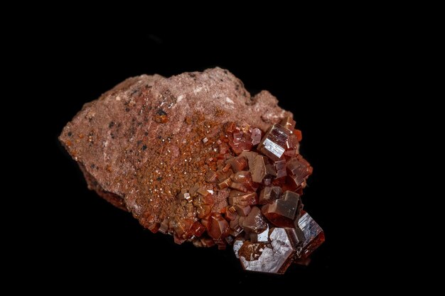 Macro mineral stone Vanadinite on a black background