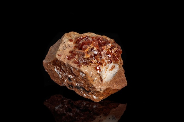 Macro mineral stone vanadinite on a black background