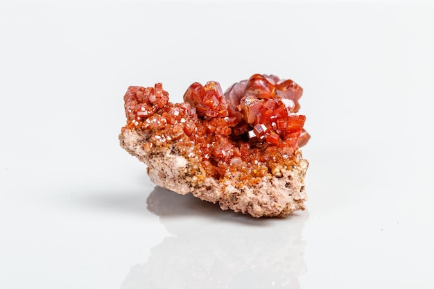 Macro mineral stone Vanadinite on a white background