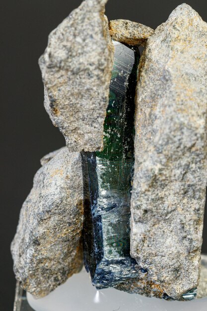 Photo macro mineral stone vivianite on a black background