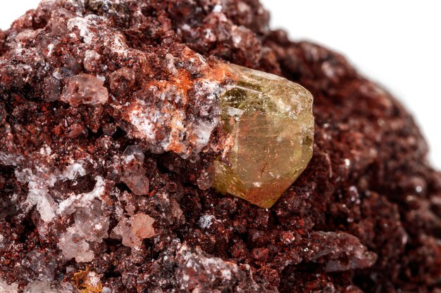 Macro mineral stonexAGolden Apatite on a white background