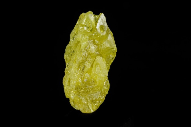 Photo macro mineral sulfur stone on a black background