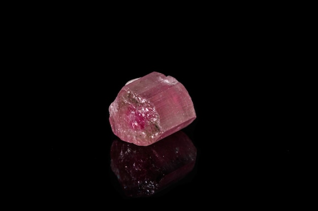 Macro mineral tourmaline stone on black background