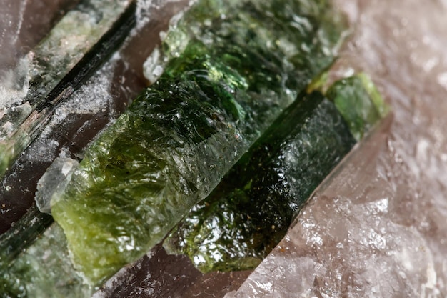 Macro mineral tourmaline stone in quartz on a white background