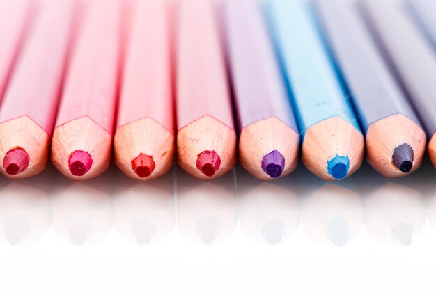 Macro multicolored pencils on a white background