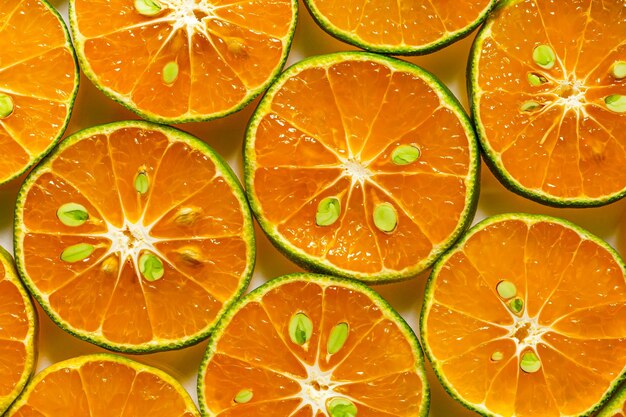 macro oranje achtergrond, Hoop van verse sinaasappelschijfjes achtergrond. Gezonde voeding met vitamine c.