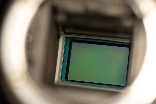 Macro photo of an APSC camera sensor Old dslr camera showing its sensor behind mirror before cleaning