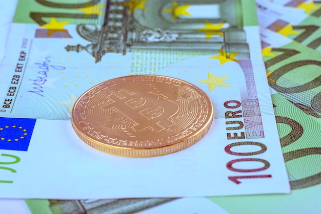 Macro photo - background of the European currency, the Euro, and bitcoin