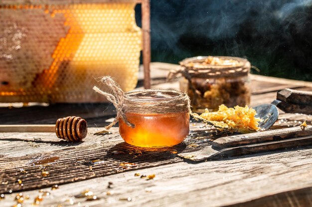 Photo macro photo of a bee hive on a honeycomb bees produce fresh healthy honey honey background beekeeping concept long banner format