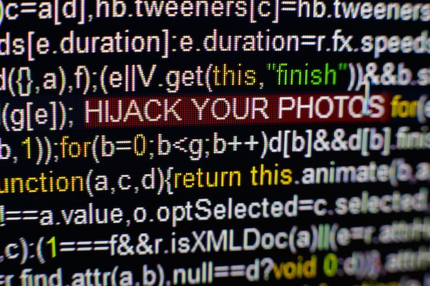 Photo macro photo of computer screen with program source code and highlighted hijack your photos