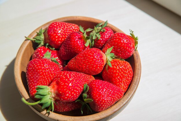 Macro photo of a ripe red large strawberry with a small depth of field