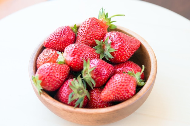 Macro photo of a ripe red large strawberry with a small depth of field