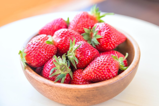 Macro photo of a ripe red large strawberry with a small depth of field