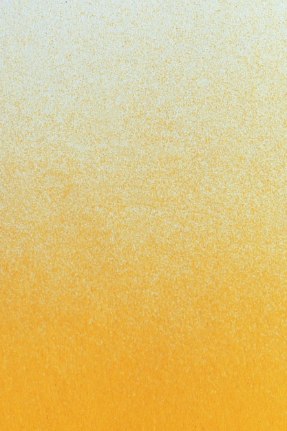 Macro photography of orange color spray paint on white paper