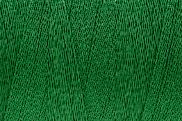 Macro picture of thread texture green color background