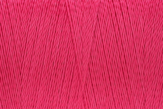 Photo macro picture of thread texture pink color background