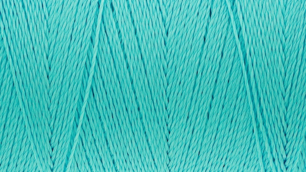 Photo macro picture of thread texture turquoise color background