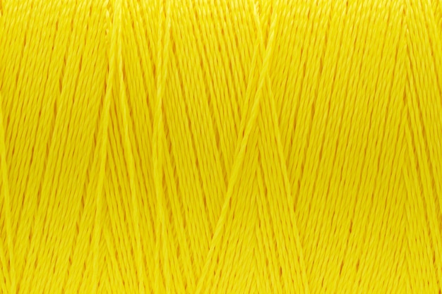 スレッドテクスチャ黄色の色の背景のマクロ写真