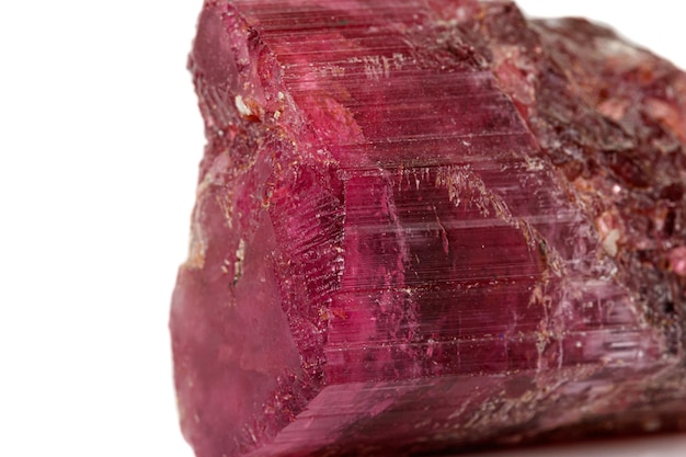 Macro red tourmaline mineral stone on white background