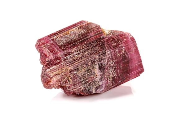 Macro red tourmaline mineral stone on white background