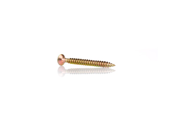 Macro screw of golden color on a white background