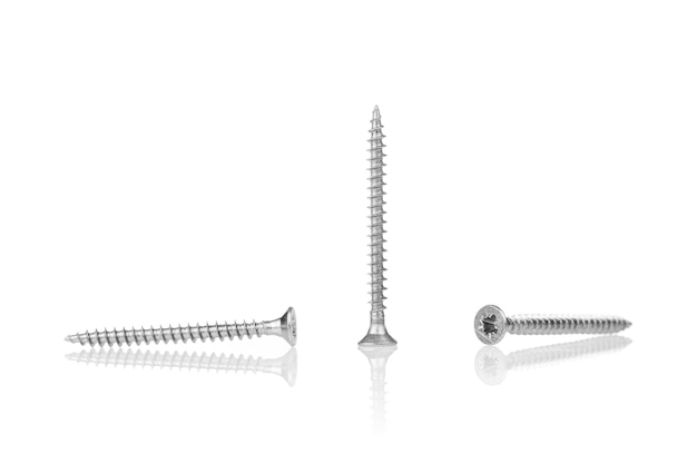 Macro screw of silver color on a white background