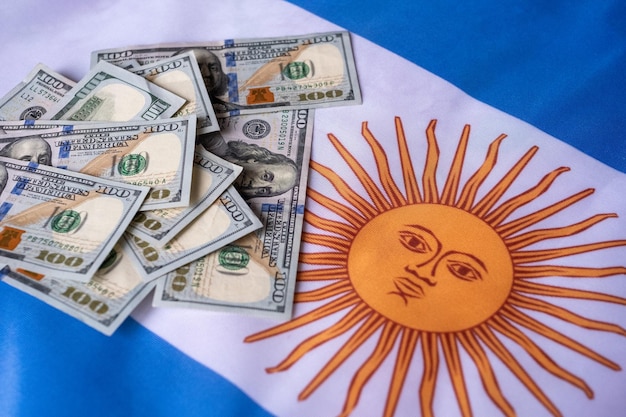 Macro shot of american dolar on argentina flag