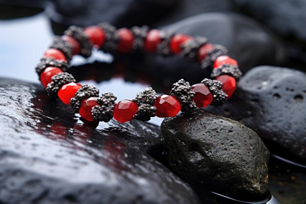 A macro shot of a beaded bracelet on a rough volcanic rock