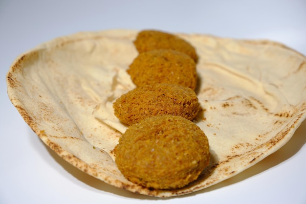 macro shot of eating falafel on lavash