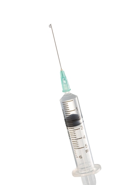 Macro shot of a hypodermic needle with a droplet of fluid on the tip With clipping path