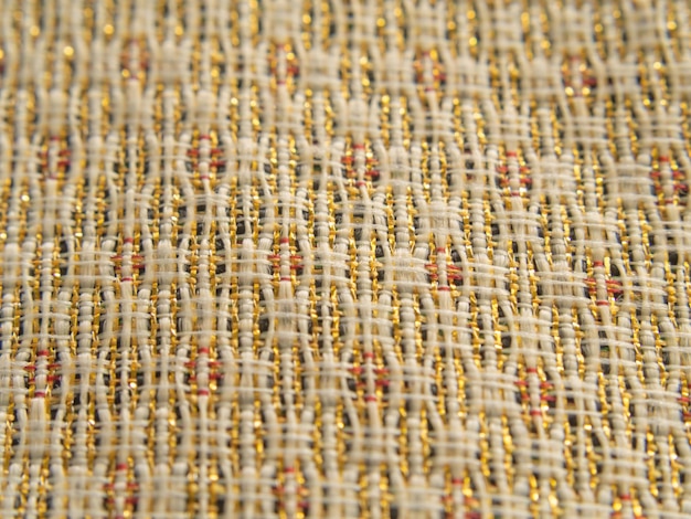 Macro shot mesh pattern of golden texture Background and mesh weave textile texture