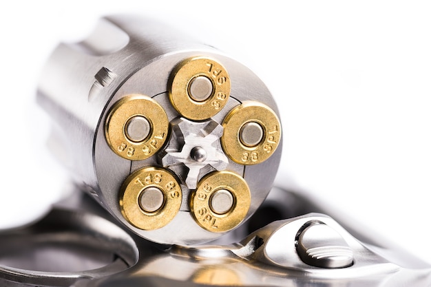 Macro shot of an open revolver loaded with bullets