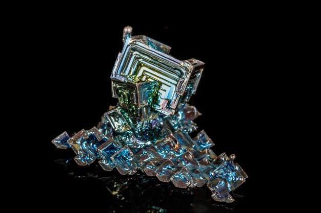 Macro of the stone bismuth mineral on a black background