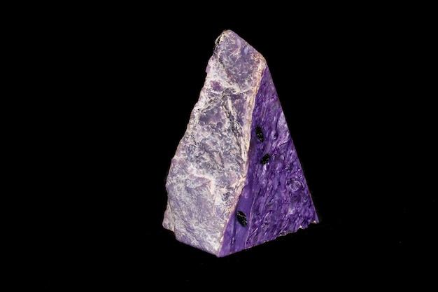 Macro stone Charoite mineral on a black background