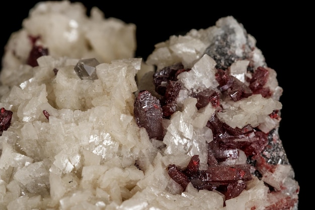 Macro stone Cinnabar dolomite mineral on a black background