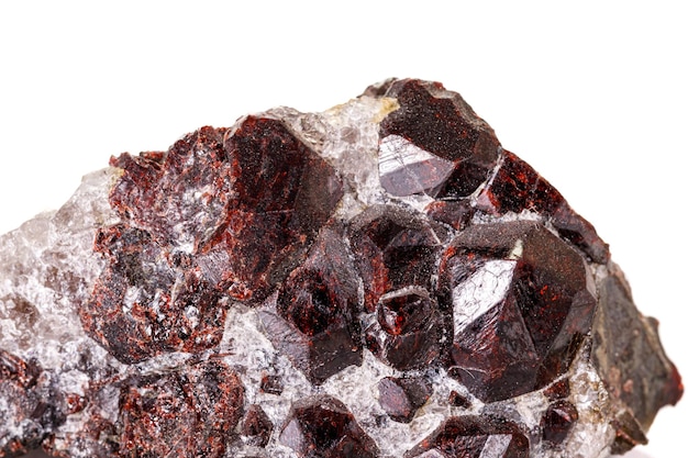 Macro stone garnet mineral on white background