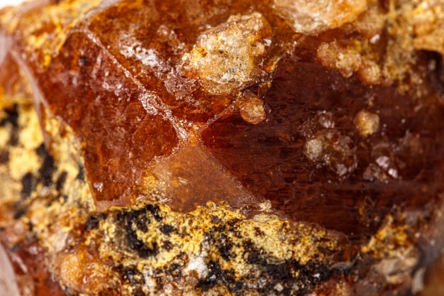 Macro stone Grossular mineral on white background