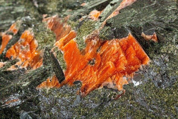 Photo macro stone mineral diopside calcite magnetite on a white background