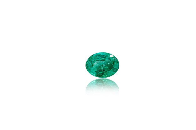 Macro stone mineral Emeralds on a white background