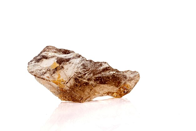 Macro stone mineral smoky quartz on a white background