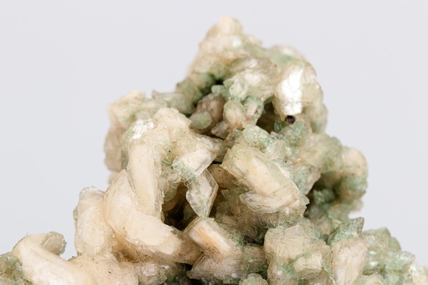 Macro stone mineral stilbite on Apophyllite on a white background